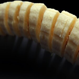A detailed macro shot of fresh banana slices, showcasing their texture and natural freshness.