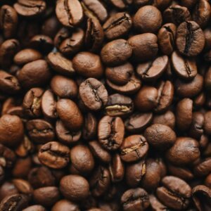 A detailed close-up view of aromatic roasted coffee beans, perfect for beverage-related content.